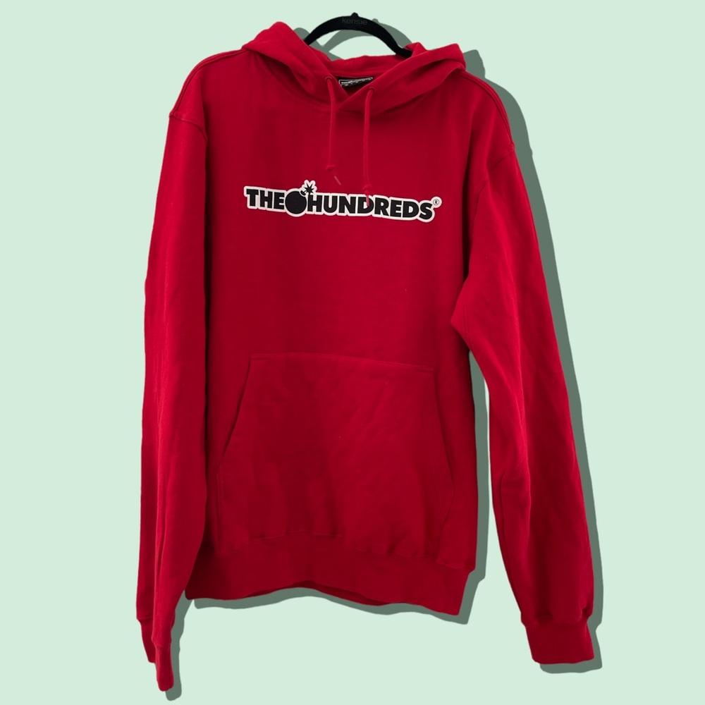 The Hundreds red hoodie with logo on front.